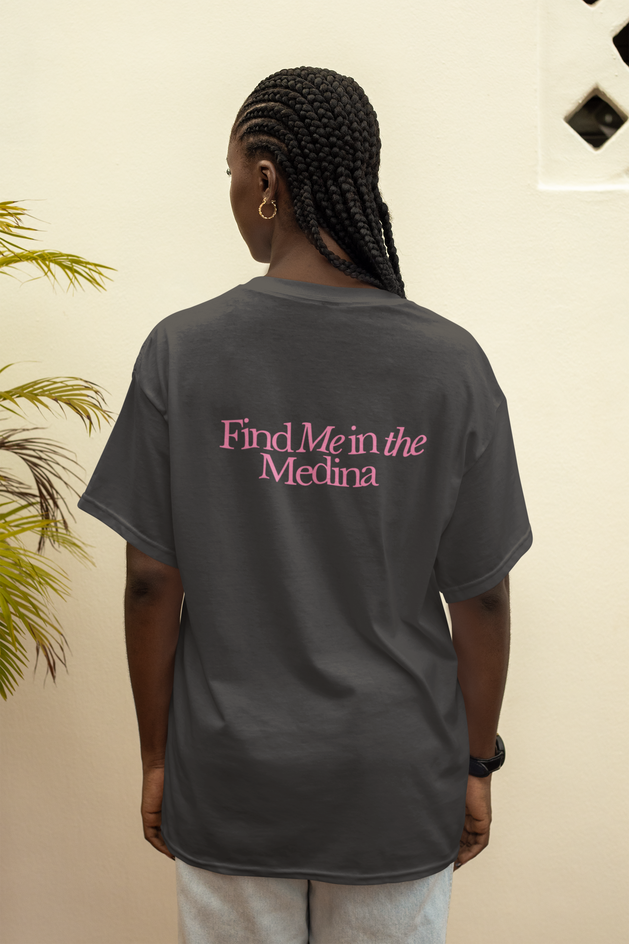 Back view mockup featuring a woman with braided hair wearing a T-shirt. Casual and stylish look, perfect for everyday fashion and laid-back vibes